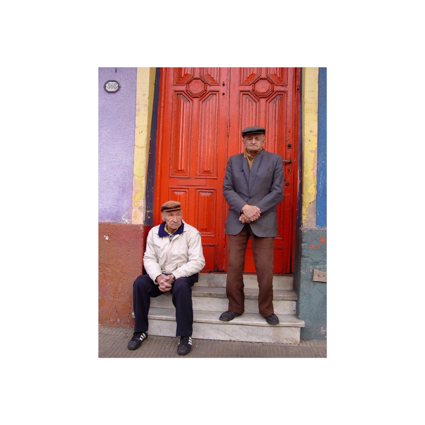 Two Men at the Red Door — La Boca Street Portrait | "Argentinidad" Exhibition | Rômulo Fritscher
