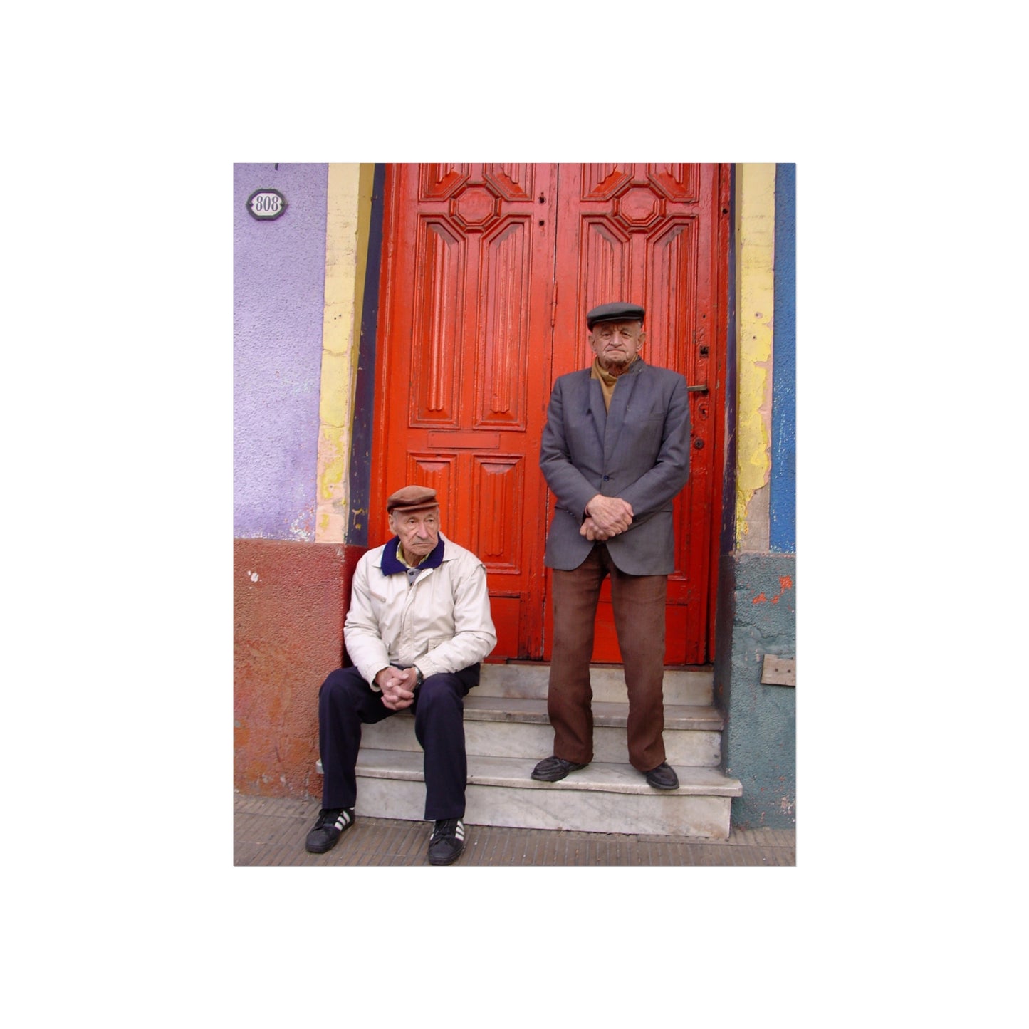 Two Men at the Red Door — La Boca Street Portrait | "Argentinidad" Exhibition | Rômulo Fritscher